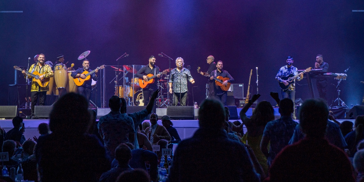 Gipsy Kings band performing on stage with guitars